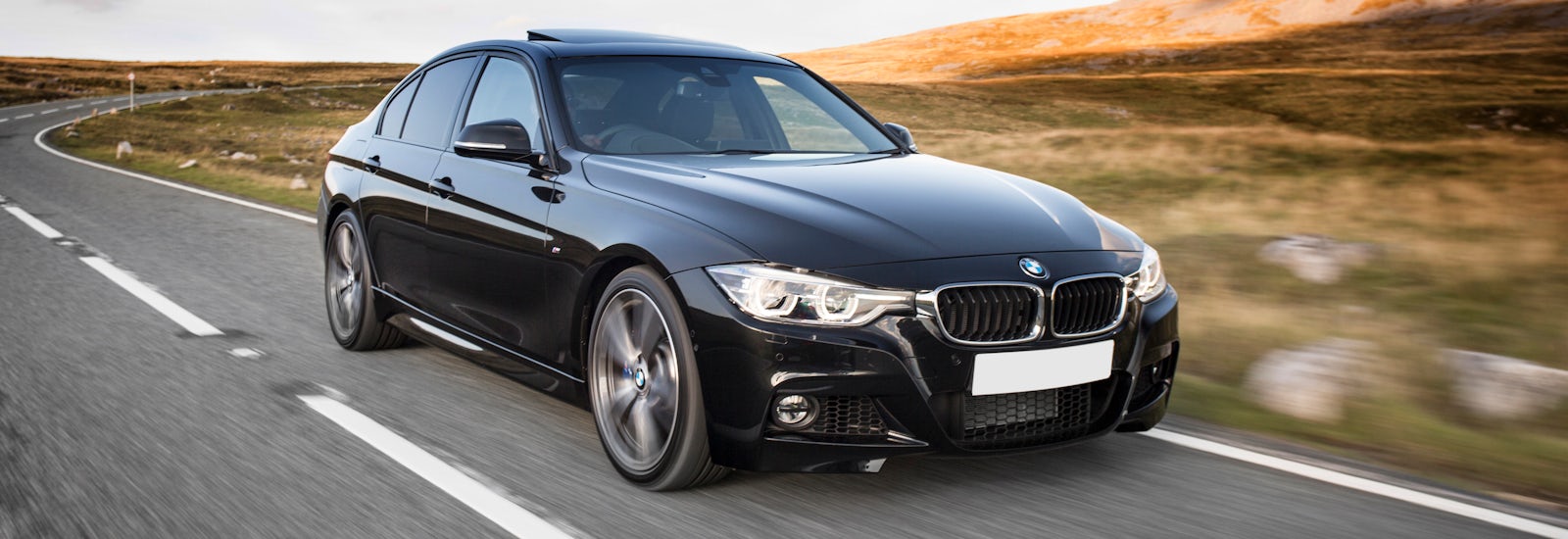 bmw 3 series black driving front