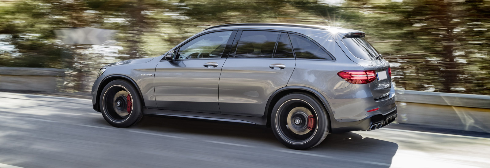 mercedes-amg-glc-63-grey-rear-driving-1.jpg